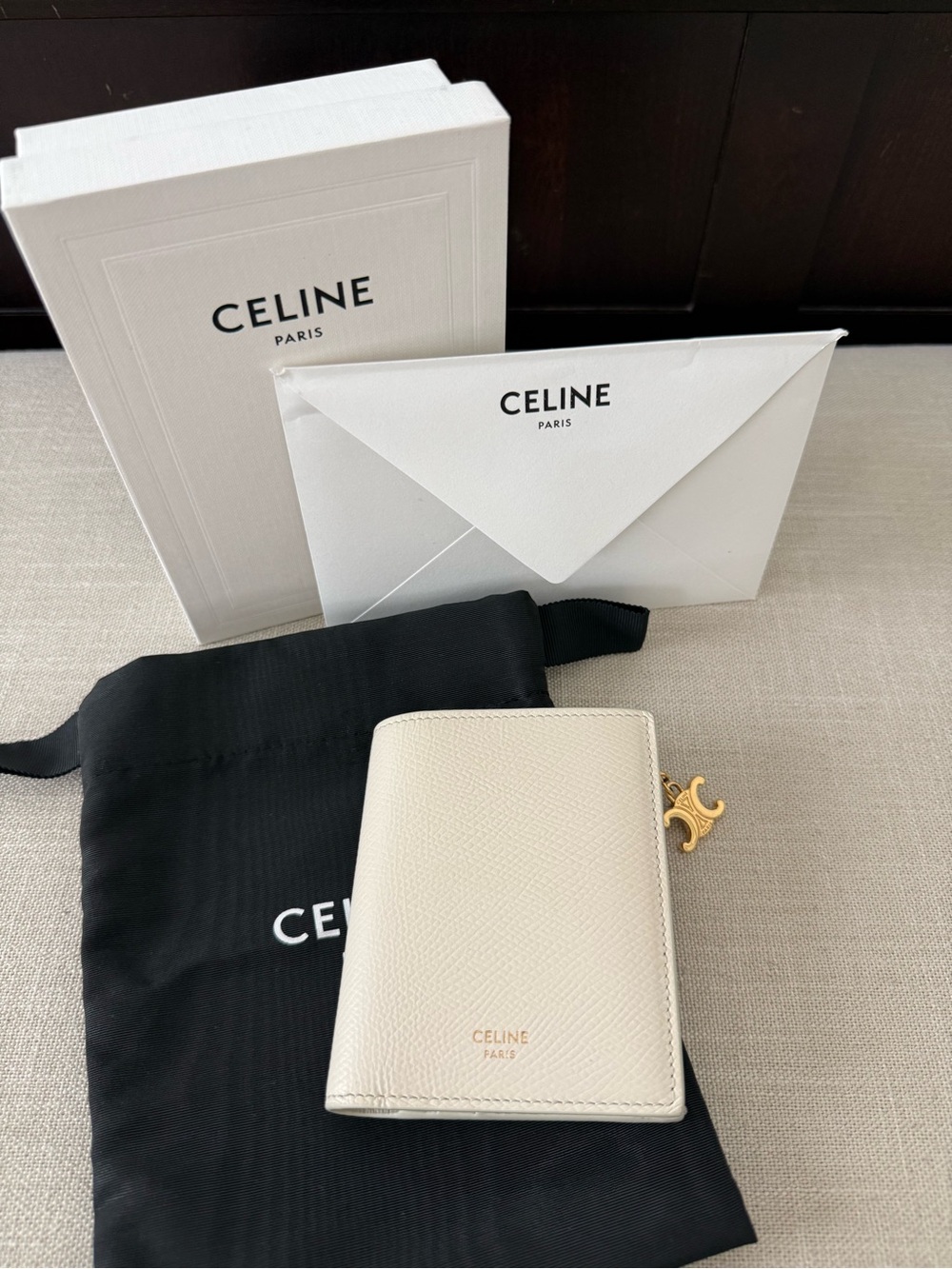 CELINE COMPACT WALLET TRIOMPHE CHARMS IN GRAINED CALFSKIN